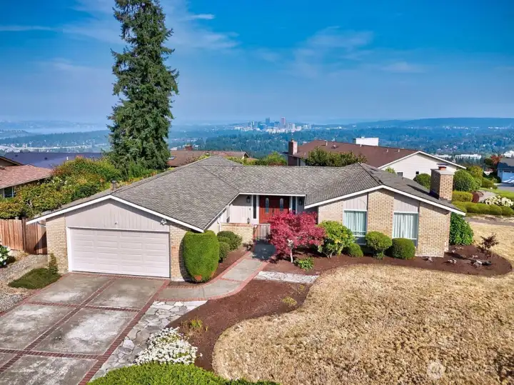 Perched atop Somerset with western exposure, front door faces East. This level and sunny lot features large corner lot with manicured grounds.