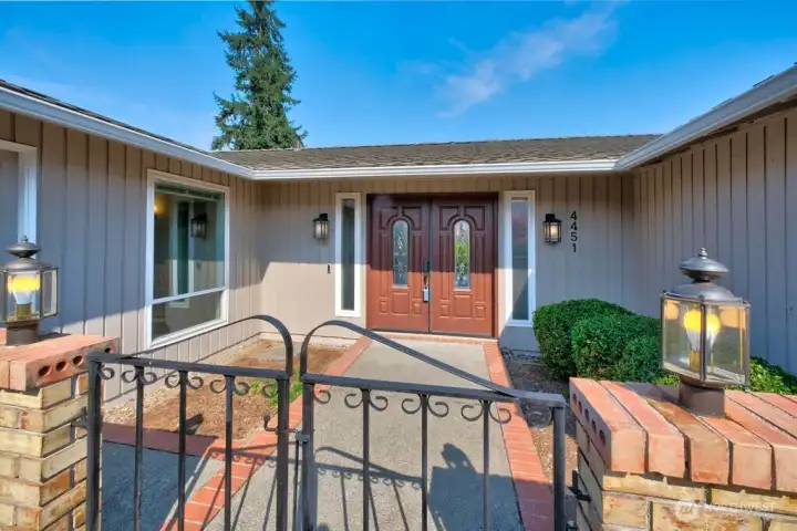 Private courtyard entry with garage side door access. Newer front door