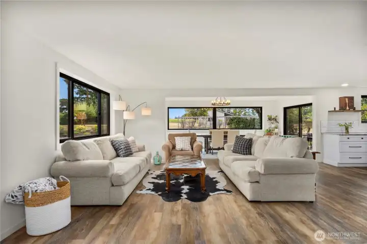 Big picture windows fill the home w/ natural light