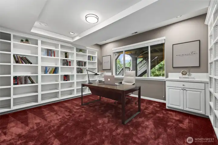 Basement library/office/bedroom. This photo is virtually staged.