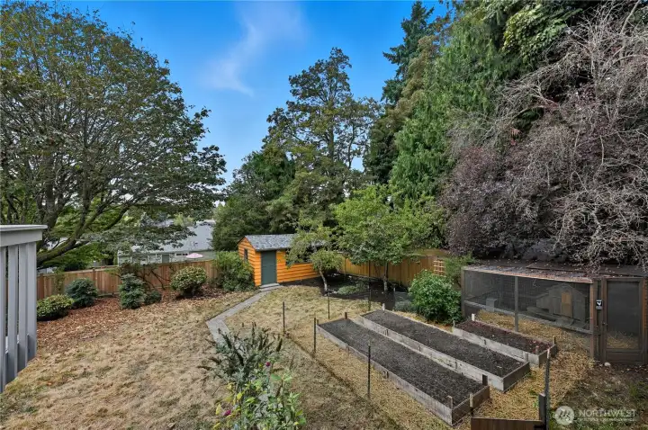 Fully fenced yard and raised garden bed.