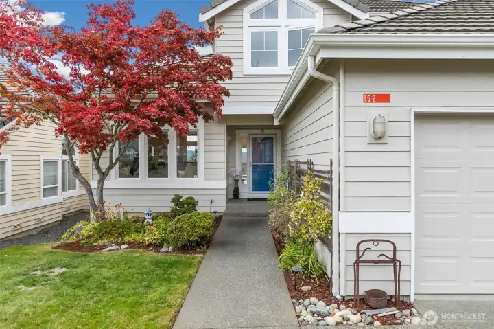Welcome to a charming entrance framed by easy-care landscaping, ready for you to personalize and make your own!