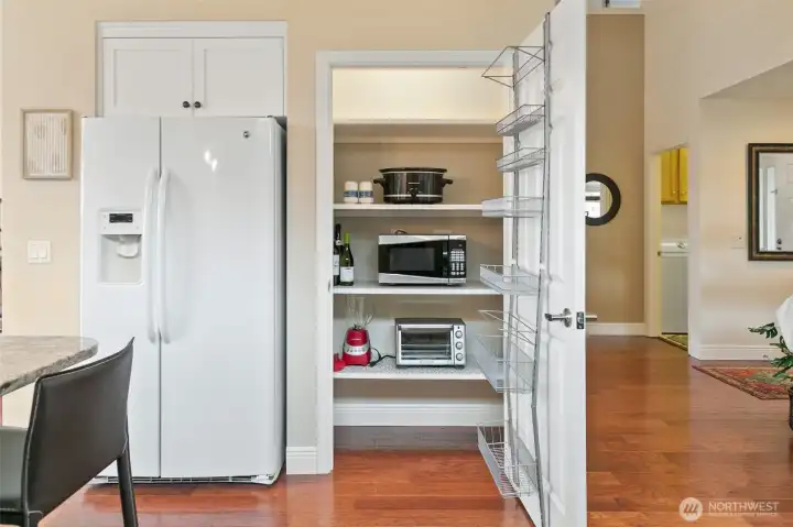 Generous pantry providing ample storage for all your essentials.
