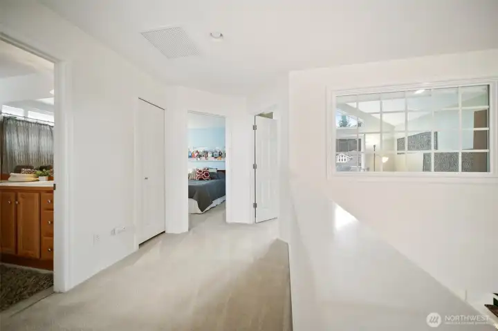 Ascend the stairs to discover two inviting guest bedrooms, a well-appointed full bathroom, and a charming office with a stunning view!