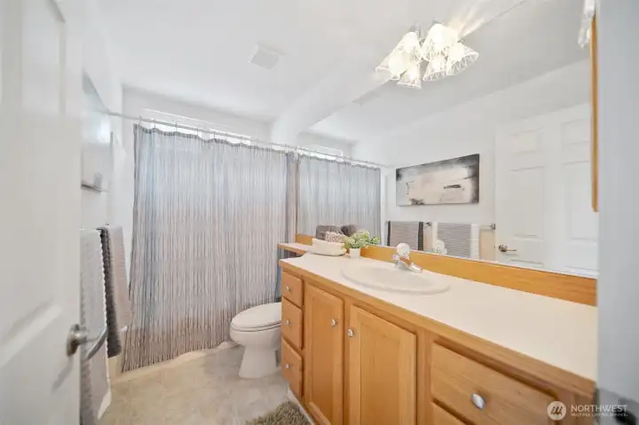 A well-appointed full bathroom upstairs ensures comfort and convenience for your guests.