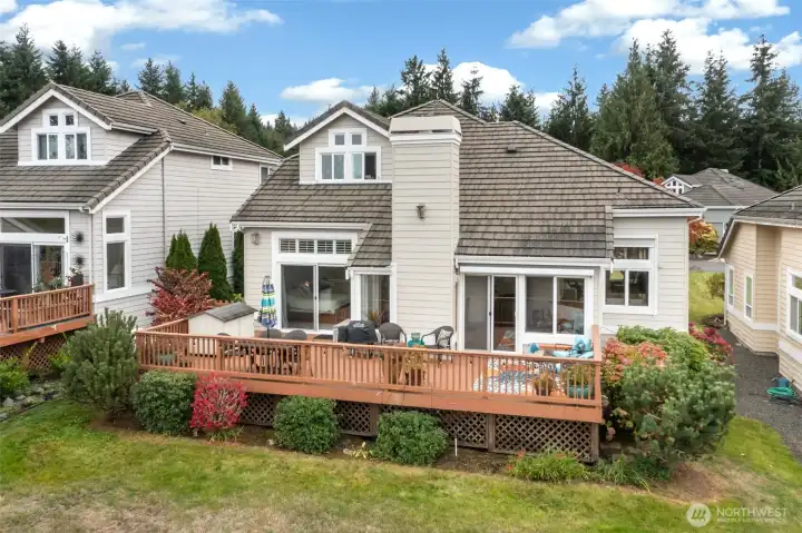 "The back deck offers a spacious layout with low-maintenance landscaping, perfect for relaxation and outdoor enjoyment.