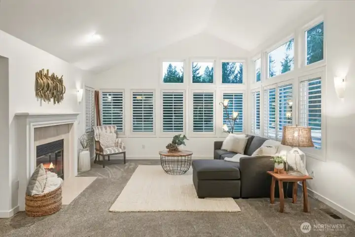 The intimate yet spacious living area offers a cozy retreat, while stunning plantation shutters add timeless elegance.