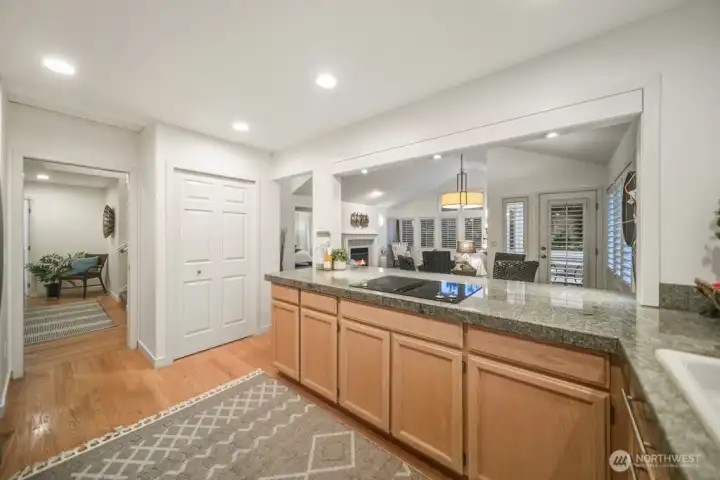 The expansive kitchen overlooks the dining and living areas while remaining open to the welcoming entryway.