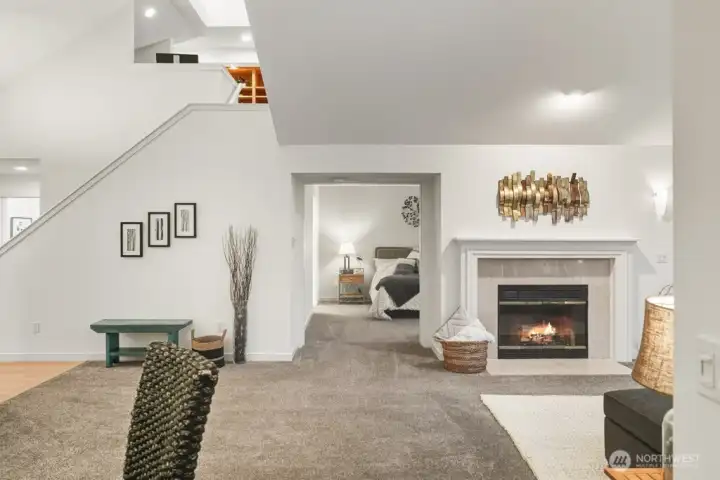 This view reveals easy access to the primary bedroom, where clever pocket doors ensure privacy while maximizing space.