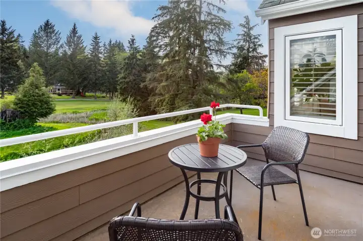 The private second-floor balcony off the primary bedroom offers sweeping, postcard-perfect views of the velvety green golf course and shimmering pond—elevated serenity with built-in security and blissful privacy that feels worlds away. There is also additional outdoor storage!