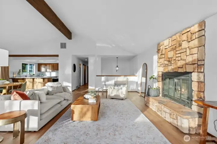 Floor to ceiling stone wood burning fireplace