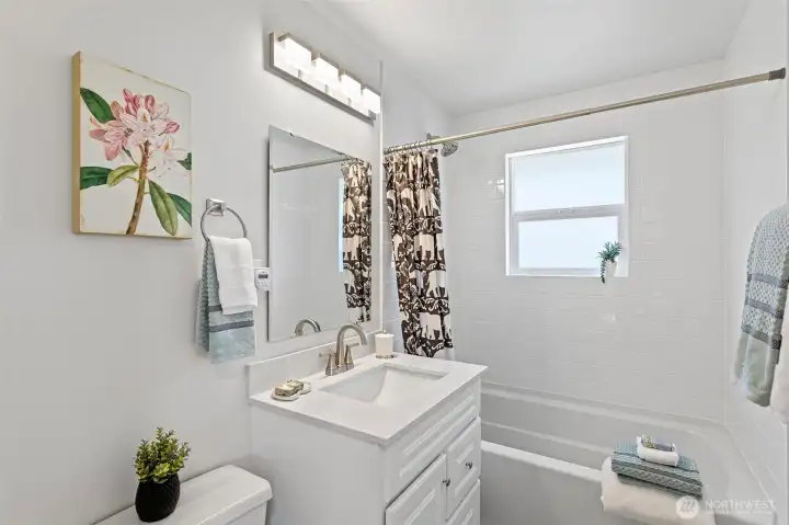 A fully updated main-floor bath with clean lines, fresh finishes, and a bright, timeless feel.
