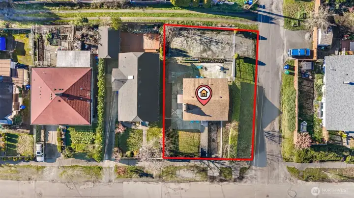 Aerial view of the corner lot with approximate boundaries shown; fully pre-inspected, priced accordingly, and offered in its present condition.