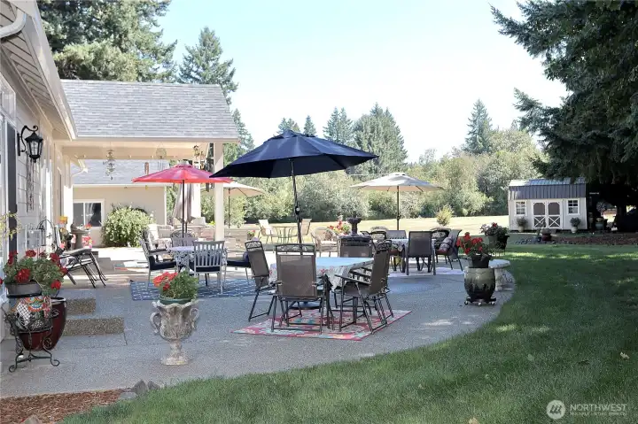 Oversized patio provides generous outdoor seating and  room for