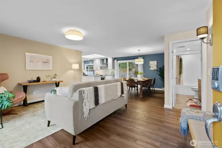 Bright and open living room flow to dining and kitchen.