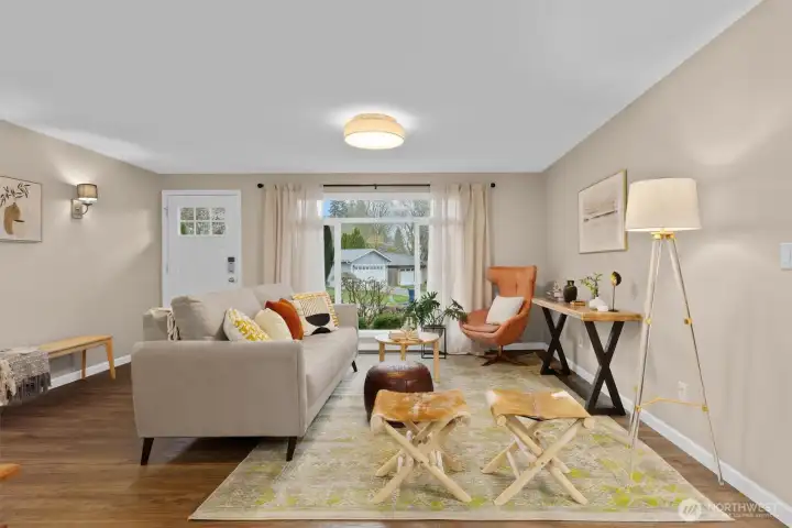 View from dining through living room to front yard.