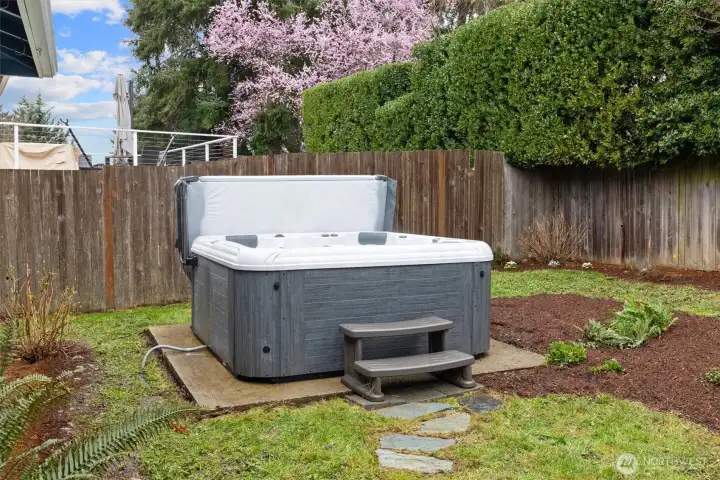 Concrete pad with hot tub hookup.