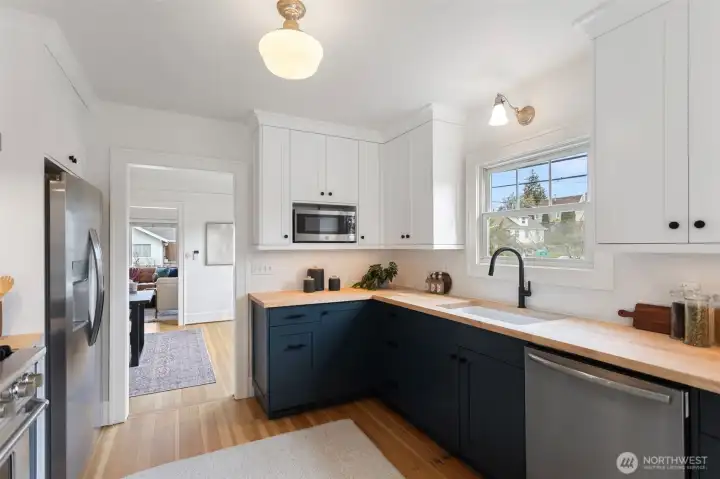 Beautifully designed kitchen with custom cabinets, new counters