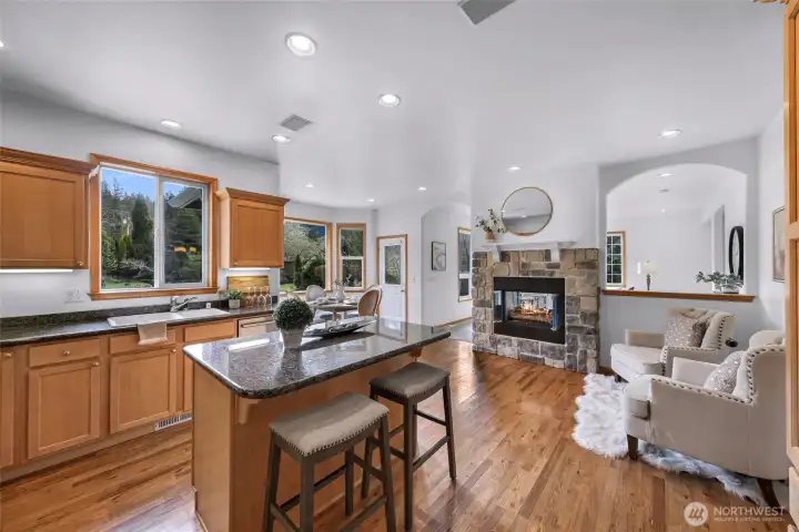 Keep the chef company in the kitchen at the bar or near the warmth of the central fireplace