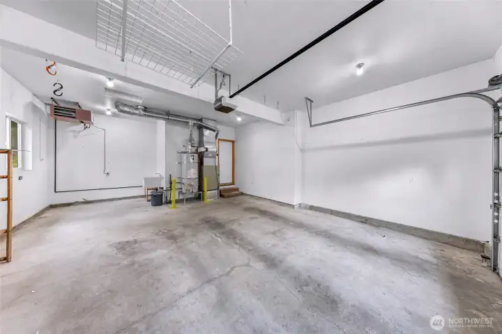 Heated 2-car garage with utility sink, and room for workshop, gear storage