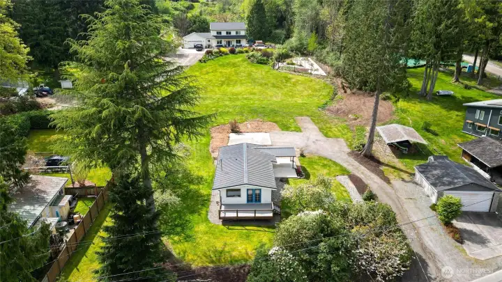 Situated on a sunny 0.5 acre lot on the quiet side of Lake Samish.