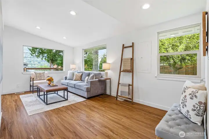 The living area is at the front of the home with views out towards the lake.