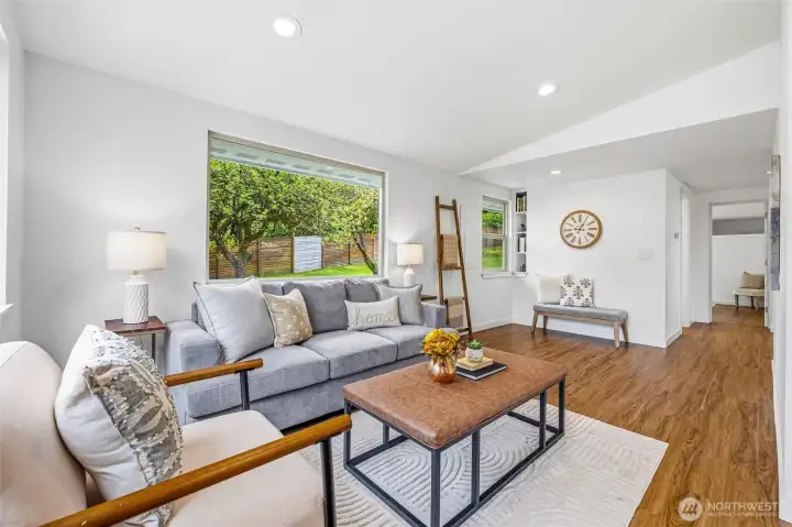 A view of the living area towards the back of the home.