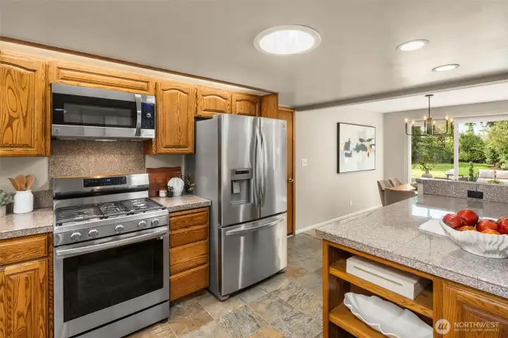 Kitchen opens to dining area and living areas.