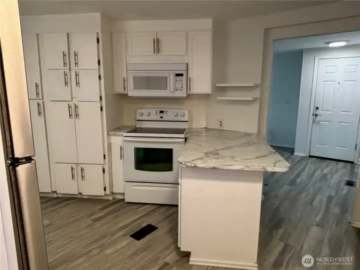 Lots of cabinet space in kitchen.