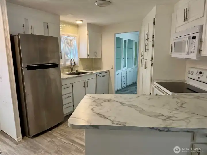 Small eating bar looking into kitchen