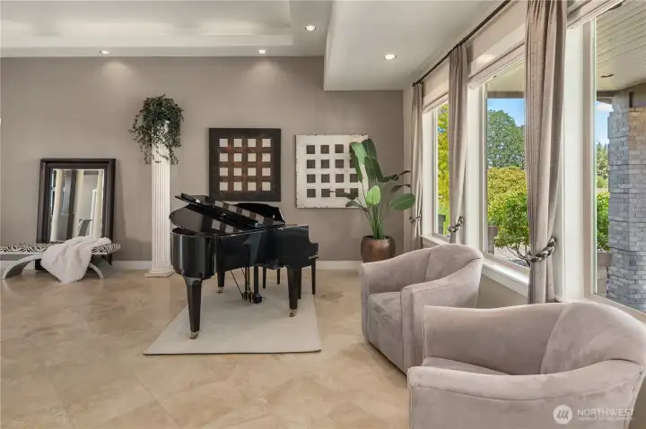 Natural light streams in through a wall of picture windows~