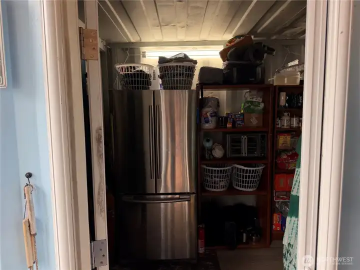 Enter into shipping container #1 comes with full size refrigerator and pantry shelving.