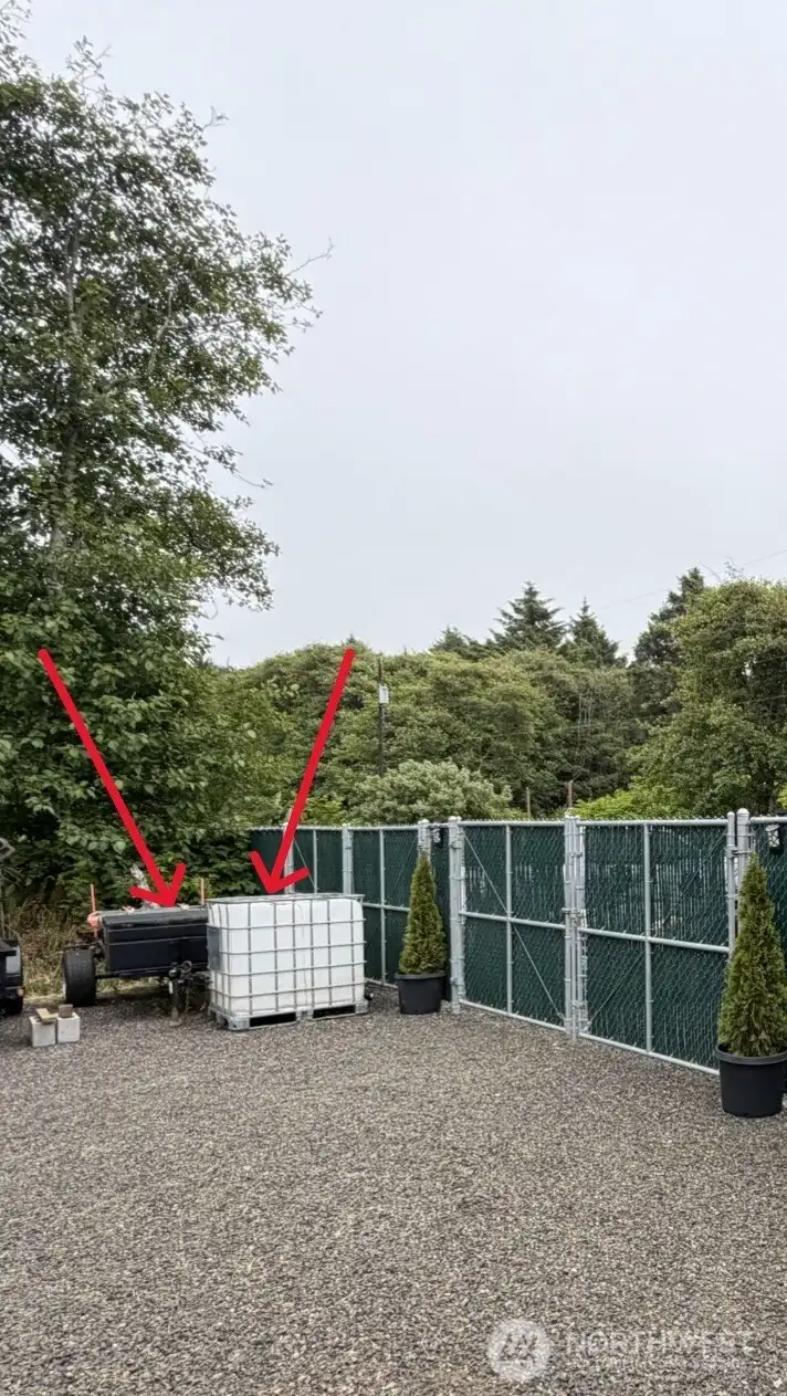 Small trailer and grey water holding tank conveys with property
