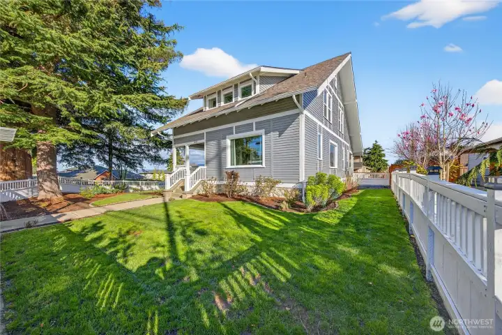 lovely corner location with large fenced in yard; home has a fresh coat of paint.