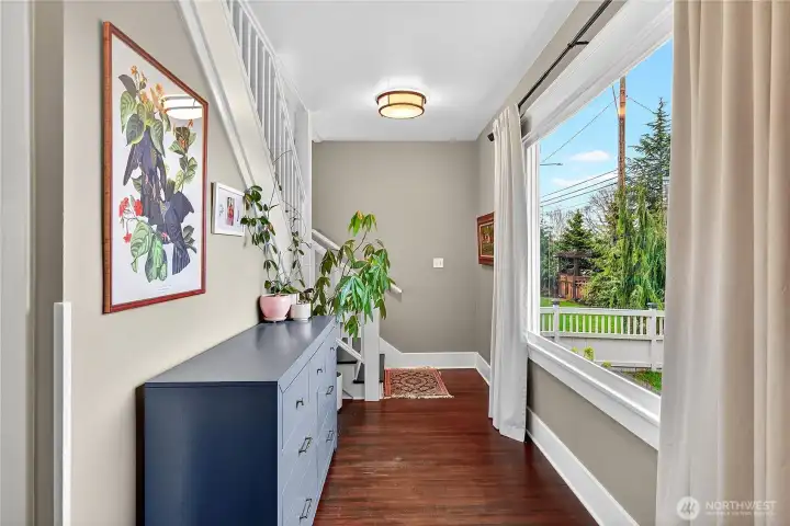 Entry area overlooks the front yard; stairs to the second level with additional 3 bedrooms/2 baths.