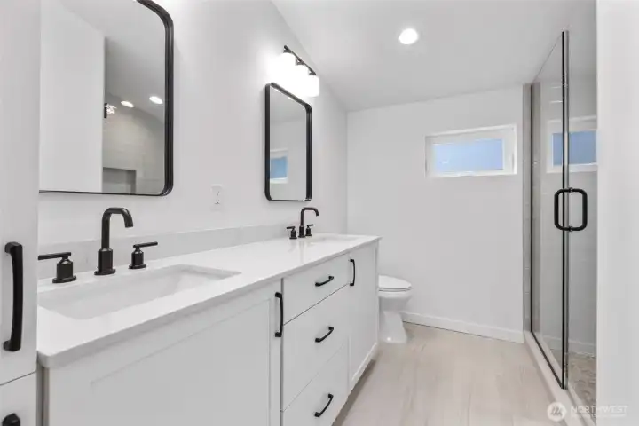 Primary bath with dual vanities and linen cabinet
