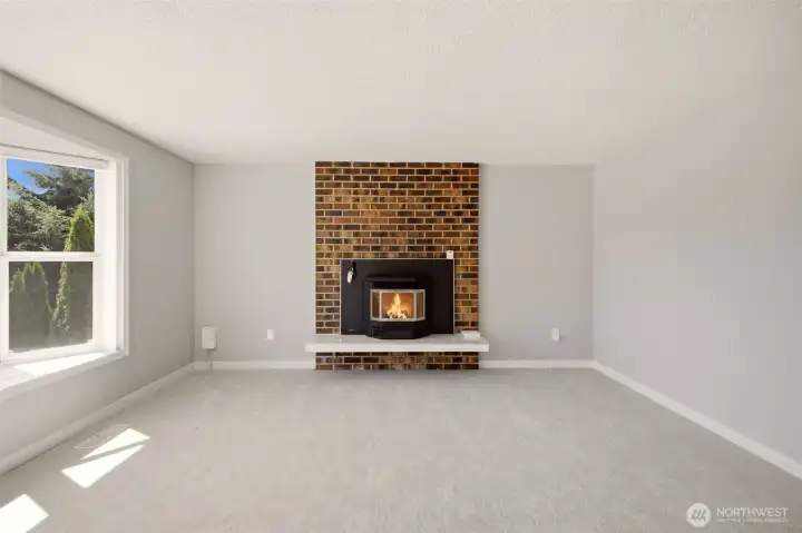 Bright main living space with pellet stove