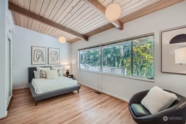 Secondary bedroom is oversized and features hardwoods