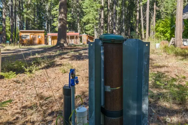 Private well with multiple water spigots throughout the property.