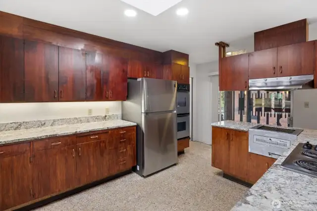 The kitchen provides abundant storage and generous counter space.