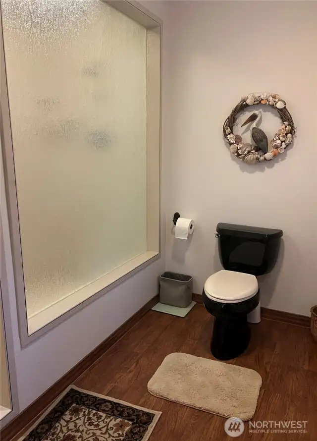 Huge walk-in shower behind the glass.