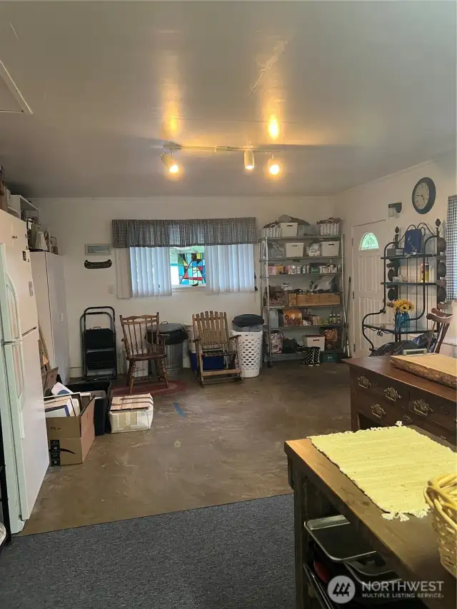 We are on the other side the house, just off the kitchen is a bonus/utility room. Lots of possibilities here.