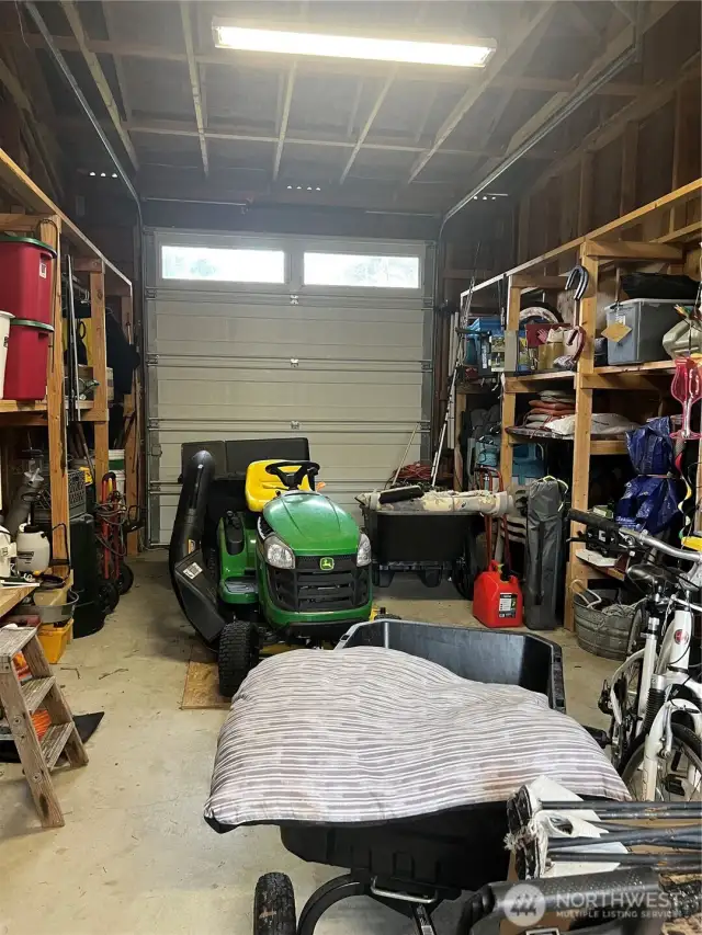 RV sized garage.  Riding lawn mower does not come with the property, but owner can discuss selling separately.