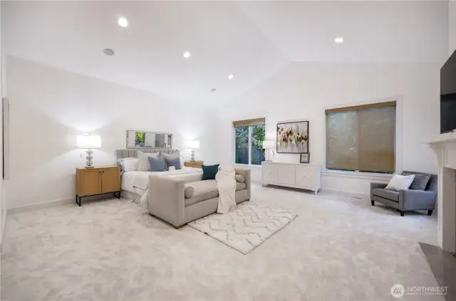 Grand master suite with vaulted ceiling and fireplace