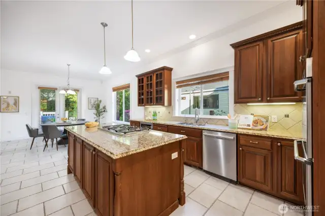 Chef's kitchen w/cherry cabinets, granite countertops & sleek SS appliances