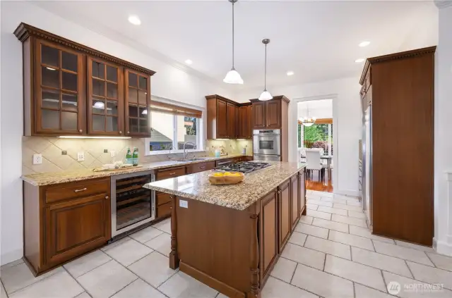 Chef's kitchen w/cherry cabinets, granite countertops & sleek SS appliances