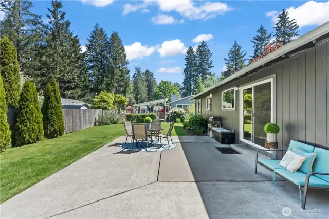This sun-drenched patio creates a seamless flow between indoor and outdoor living spaces. Picture summer brunches, cozy evening chats, and weekend gatherings—all surrounded by thoughtfully curated plants and a serene setting.