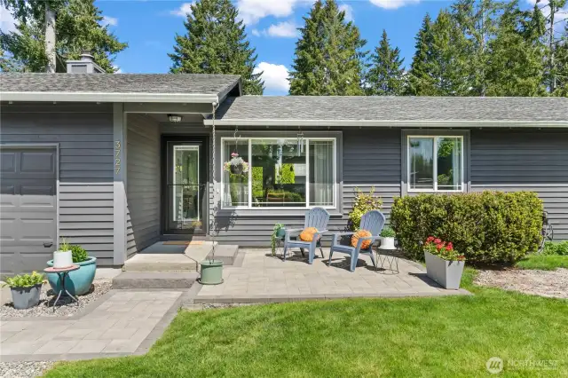 Enjoy your morning coffee or unwind in the evening on this brand new 12x12 paver patio, perfectly positioned to enhance the home’s curb appeal. Featuring cozy seating, vibrant planters, and a welcoming entrance, this low-maintenance outdoor space is ideal for relaxing or greeting guests.