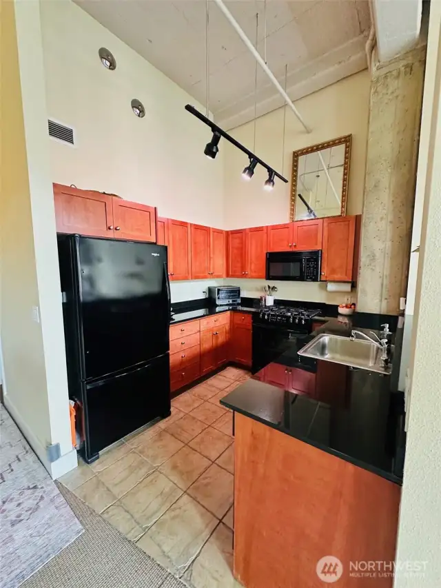 Kitchen with great lighting and quartz countertops