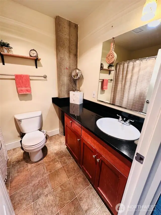 Updated bathroom with granite countertops.
